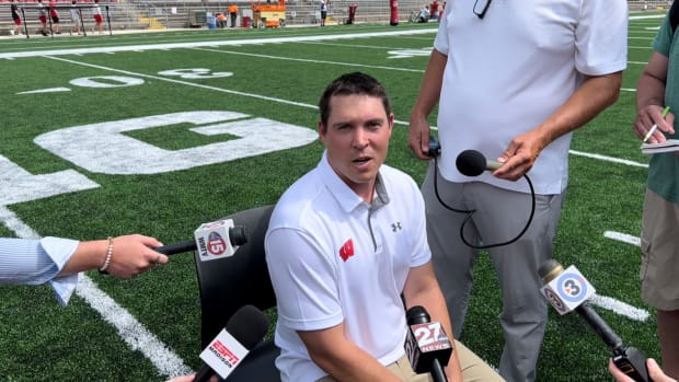 Wisconsin defensive coordinator Jim Leonhard fielding questions at football media days inside Camp Randall (Credit: Matt Belz, All Badgers)